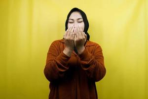 Beautiful young asian muslim woman praying, with open arms, isolated photo