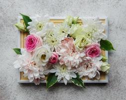 Wooden frame decorated with pink and white flowers photo