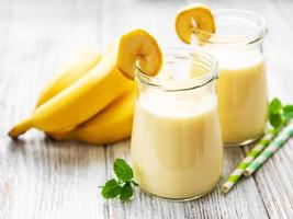 Banana yogurt and fresh bananas photo