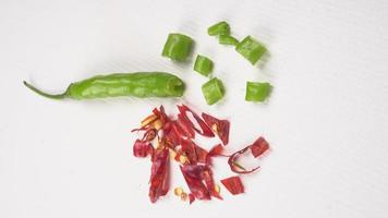 Fresh long Indian green chillies on wooden background. photo