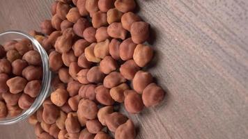 Black Chickpeas or Kala Chana with chana dal pulse isolated on wooden Background. photo