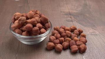 Black Chickpeas or Kala Chana with chana dal pulse isolated on wooden Background. photo