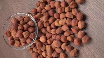 Black Chickpeas or Kala Chana with chana dal pulse isolated on wooden Background. photo