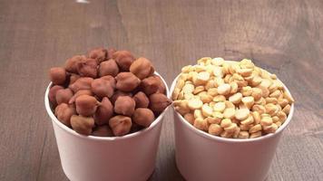 Black Chickpeas or Kala Chana with chana dal pulse isolated on wooden Background. photo