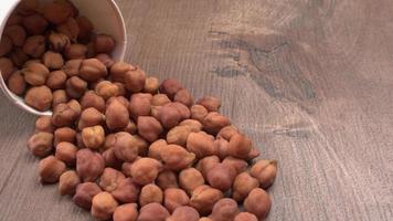 Black Chickpeas or Kala Chana with chana dal pulse isolated on wooden Background. photo