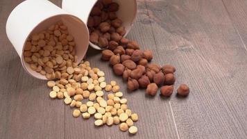 Black Chickpeas or Kala Chana with chana dal pulse isolated on wooden Background. photo