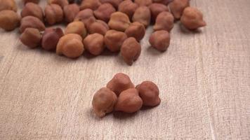 Black Chickpeas or Kala Chana with chana dal pulse isolated on wooden Background. photo