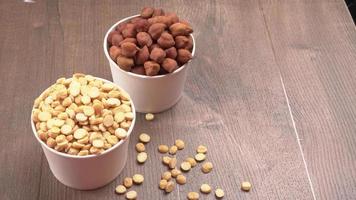 Black Chickpeas or Kala Chana with chana dal pulse isolated on wooden Background. photo