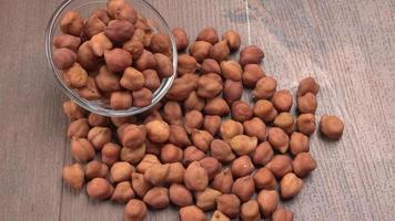 Black Chickpeas or Kala Chana with chana dal pulse isolated on wooden Background. photo