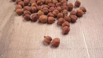 Black Chickpeas or Kala Chana with chana dal pulse isolated on wooden Background. photo