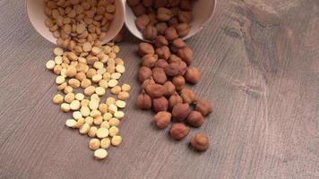 Black Chickpeas or Kala Chana with chana dal pulse isolated on wooden Background. photo