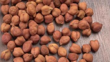 Black Chickpeas or Kala Chana with chana dal pulse isolated on wooden Background. photo