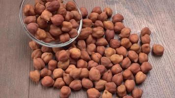 Black Chickpeas or Kala Chana with chana dal pulse isolated on wooden Background. photo