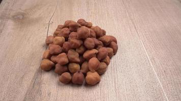 Black Chickpeas or Kala Chana with chana dal pulse isolated on wooden Background. photo