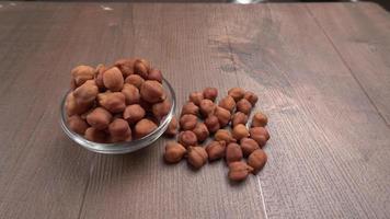 Black Chickpeas or Kala Chana with chana dal pulse isolated on wooden Background. photo