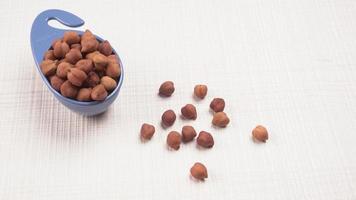 Black Chickpeas or Kala Chana with chana dal pulse isolated on wooden Background. photo