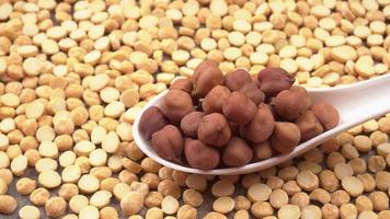 Black Chickpeas or Kala Chana with chana dal pulse isolated on wooden Background. photo