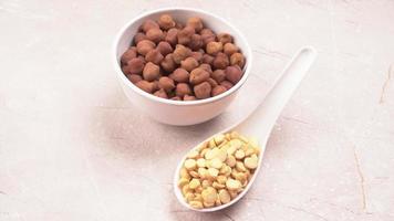 Black Chickpeas or Kala Chana with chana dal pulse isolated on wooden Background. photo