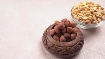 Black Chickpeas or Kala Chana with chana dal pulse isolated on wooden Background. photo