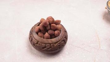 Black Chickpeas or Kala Chana with chana dal pulse isolated on wooden Background. photo
