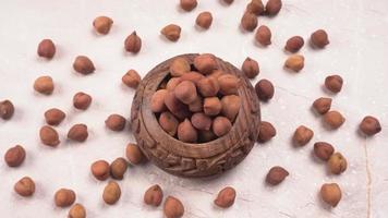 Black Chickpeas or Kala Chana with chana dal pulse isolated on wooden Background. photo