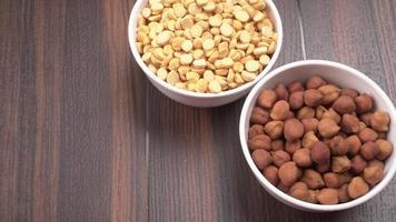 Black Chickpeas or Kala Chana with chana dal pulse isolated on wooden Background. photo