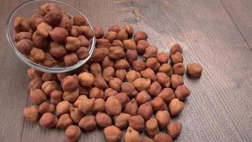 Black Chickpeas or Kala Chana with chana dal pulse isolated on wooden Background. photo