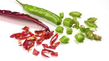 Fresh long Indian green chillies on wooden background. photo