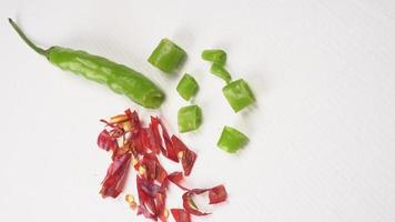 Fresh long Indian green chillies on wooden background. photo