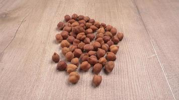 Black Chickpeas or Kala Chana with chana dal pulse isolated on wooden Background. photo