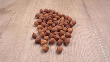 Black Chickpeas or Kala Chana with chana dal pulse isolated on wooden Background. photo