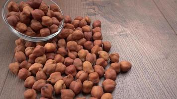 Black Chickpeas or Kala Chana with chana dal pulse isolated on wooden Background. photo