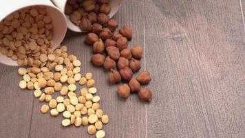 Black Chickpeas or Kala Chana with chana dal pulse isolated on wooden Background. photo