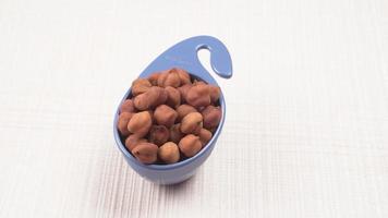 Black Chickpeas or Kala Chana with chana dal pulse isolated on wooden Background. photo