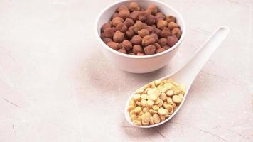 Black Chickpeas or Kala Chana with chana dal pulse isolated on wooden Background. photo