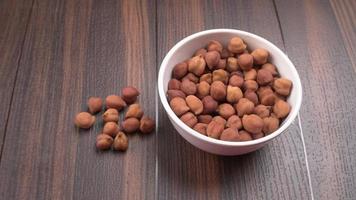 Black Chickpeas or Kala Chana with chana dal pulse isolated on wooden Background. photo