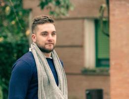 portrait of young blond man with short hair and beard photo