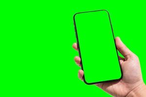 Close-up of female use Hand holding smartphone blurred images touch of green screen background. photo