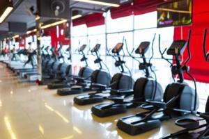 Treadmill in sport gym interior and fitness health club with sports exercise equipment and exercising cardio workout.
