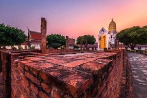 Buddha statue at sunset are Buddhist temple at Wat Phra Si Rattana Mahathat also colloquially referred to as Wat Yai is a Buddhist temple It is a major tourist attractions in Phitsanulok,Thailand. photo