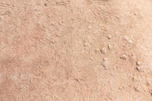 Brown dry soil or cracked ground texture background. photo