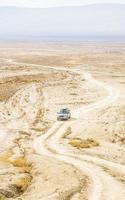 4wd car stands in the middle of nowhere in Vashlovani national park. Georgia photo