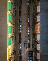 Top view cars parked by block house photo