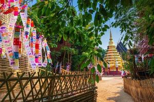 Prayer flags tung Hang with umbrella or Northern traditional flag hang on sand pagoda in the Phan Tao temple for Songkran Festival is celebrated in a traditional New Year's Day in Chiang Mai,Thailand