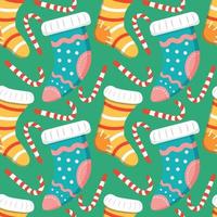 Seamless Christmas background with Christmas Knitted Socks with Patterns and candy cane striped vector