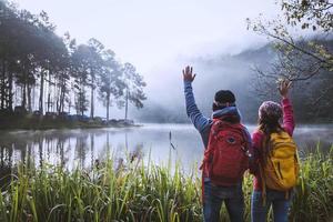 Couple lovers travel Beatiful nature at Pang ung lake and pine forest at Mae Hong Son in Thailand. photo