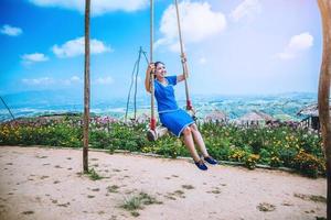 Asian women travel sleep relax.Women wear dresses. Living Swing. Thailand photo