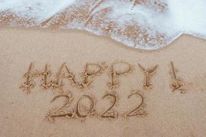 Start and go 2022 on the sand at the beach to show life ahead next year. background photo