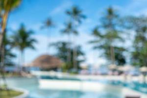 Blurry resort and hotel with a swimming pool and a beach chair photo