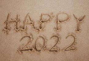 Start and go 2022 on the sand at the beach to show life ahead next year. background photo